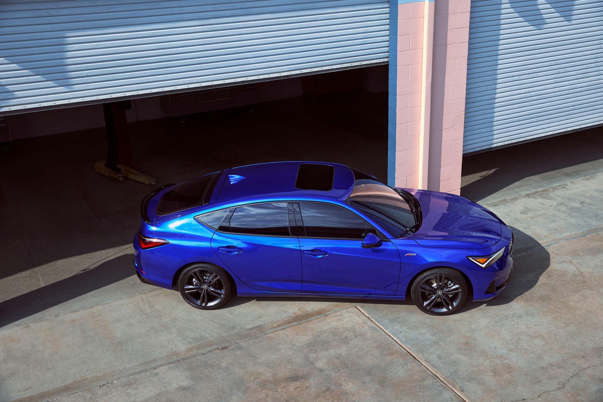 top down side view of blue 2023 Acura Integra A-Spec