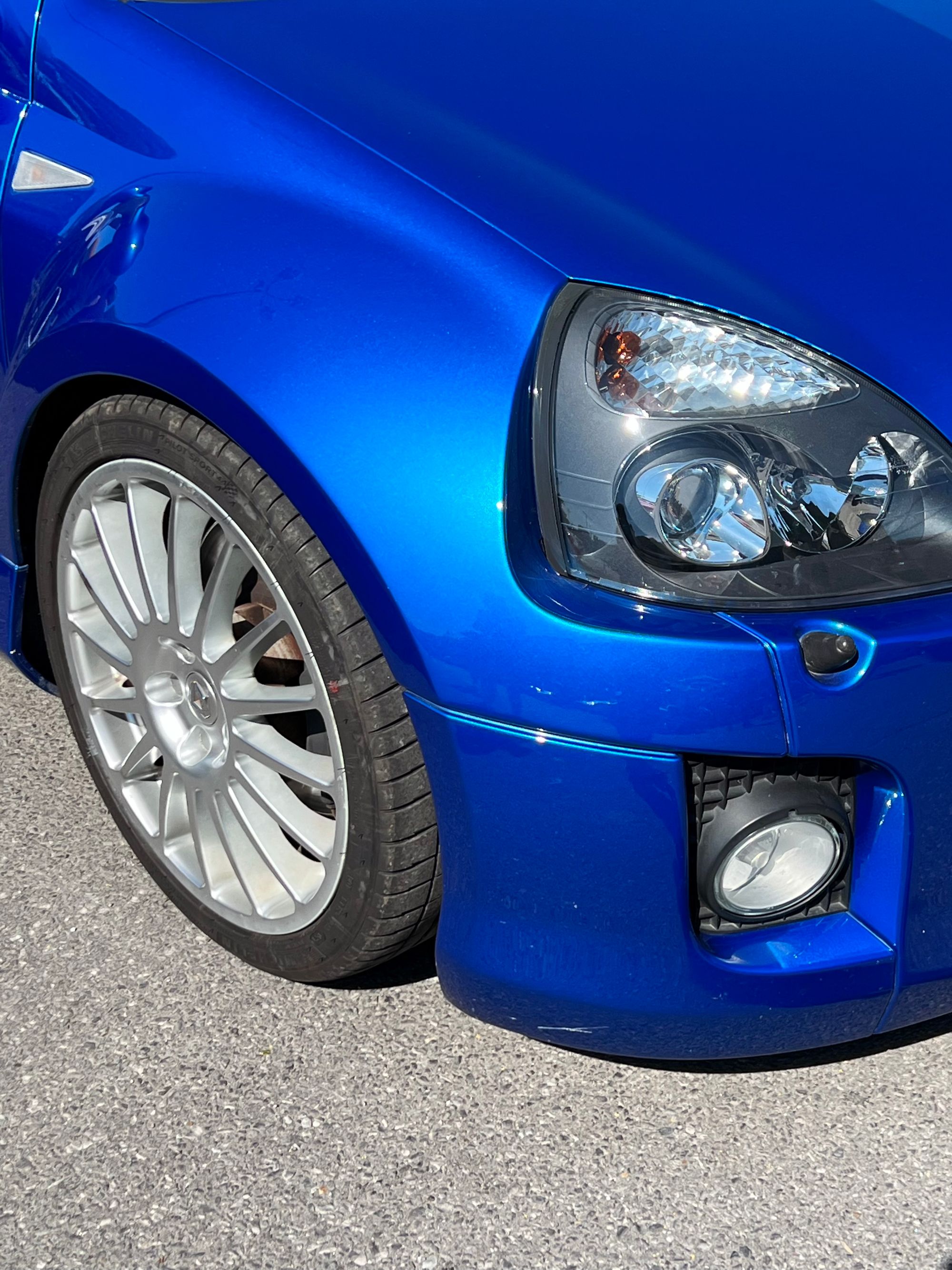 wheel and front bumper detail of renault sport clio v6