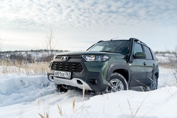 front view of lada niva travel in the snow